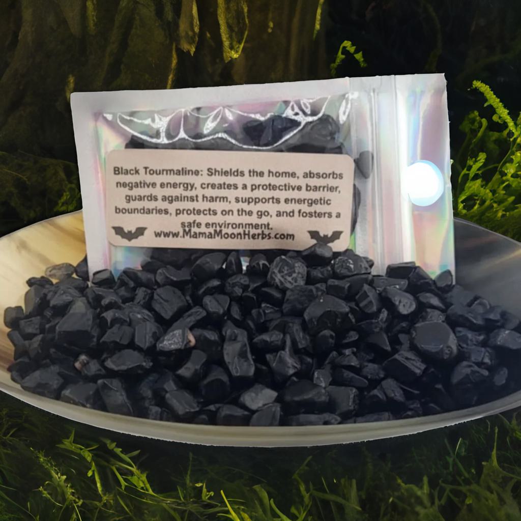 Raw Black Tourmaline crystal chips in a small ritual pouch. Ideal for banishing, grounding, and spiritual protection. Use in spell jars, grids, or candle magic.