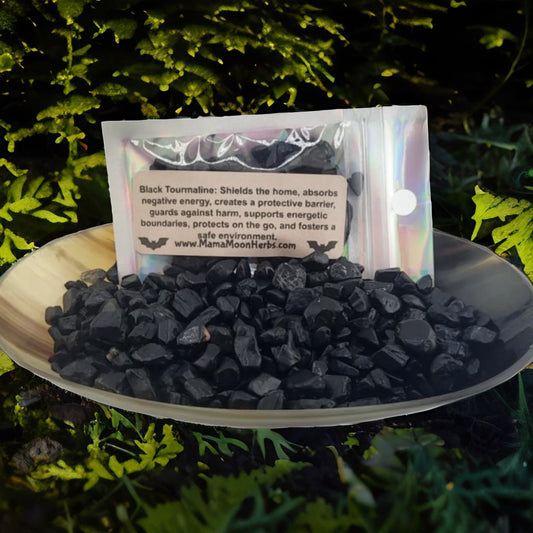 Raw Black Tourmaline crystal chips in a small ritual pouch. Ideal for banishing, grounding, and spiritual protection. Use in spell jars, grids, or candle magic.